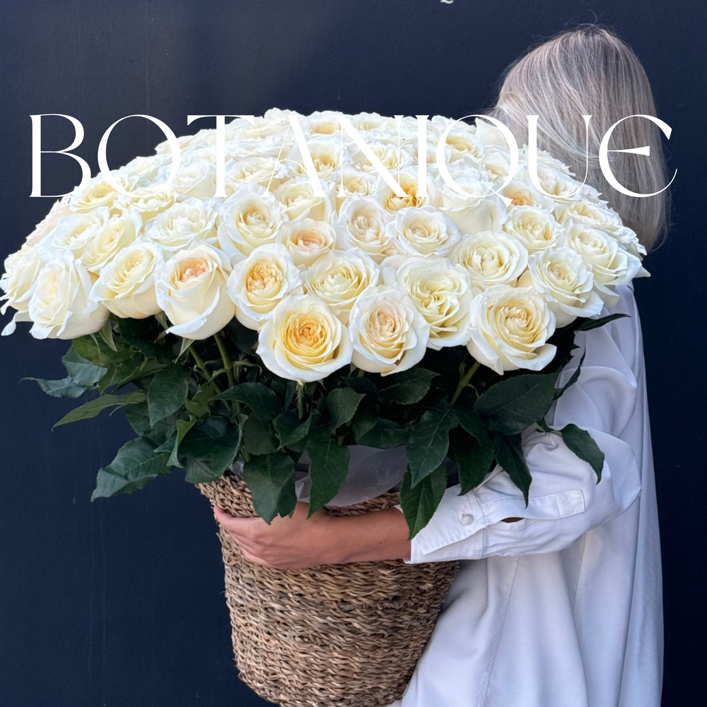 75 White roses in a basket