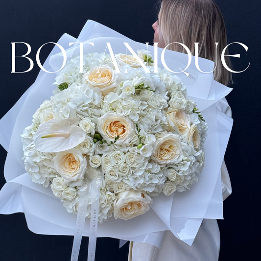 Mixed white Bouquet with roses, spray roses and Anthurium